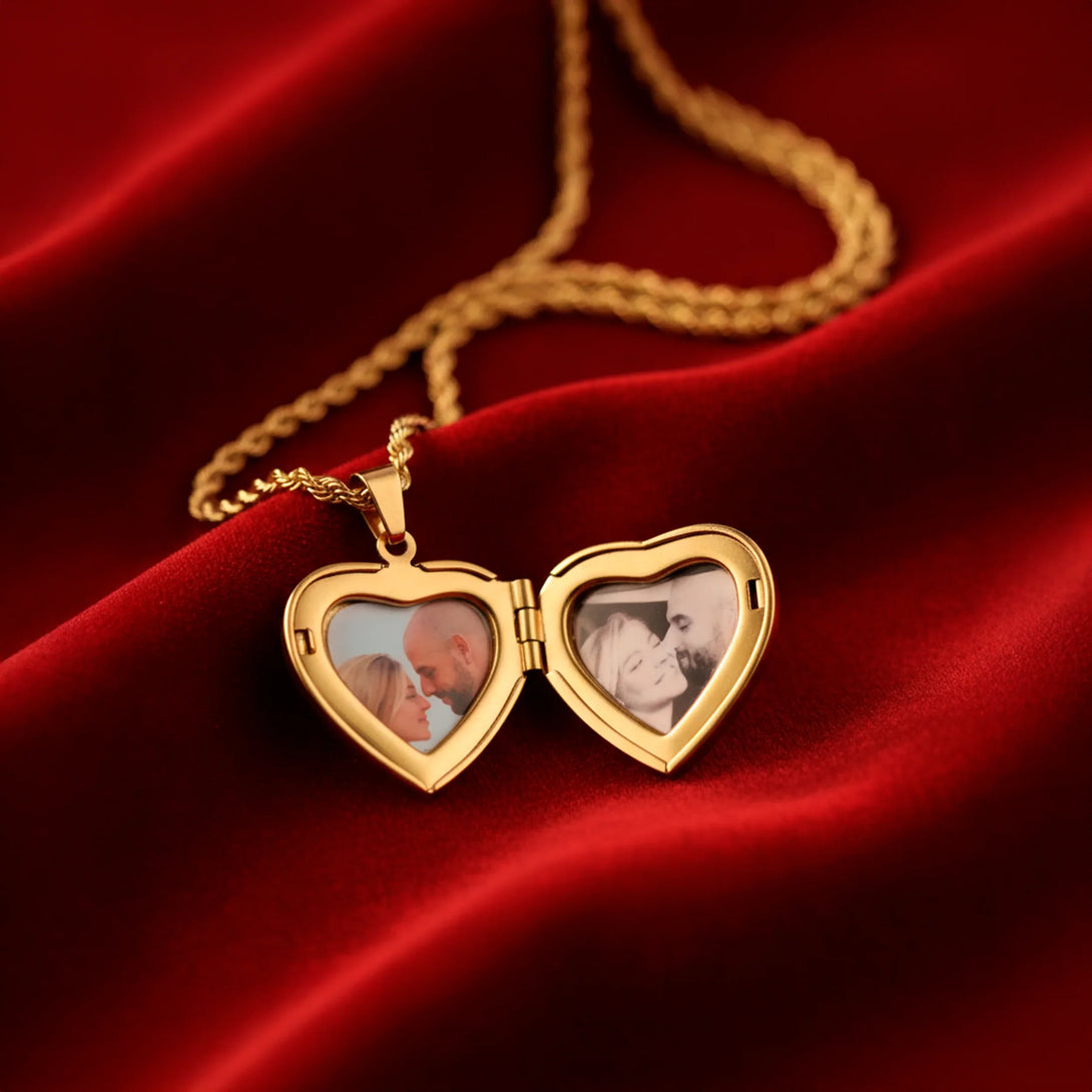 Gold heart-shaped locket necklace with couple photos on red velvet background